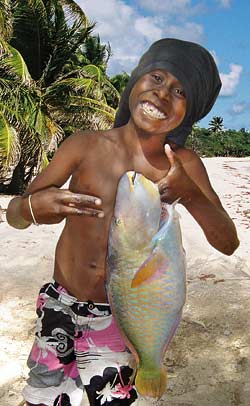 A proud young fisherman and his catch, Vanuatu.  Image: Nicolas Pascal