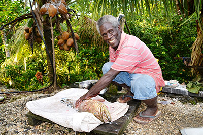 Jacob Sam Hioau preparing a grouper for lunch in Rara, Solomon Islands 