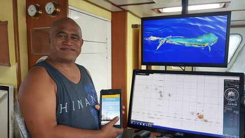 Captain using Onboard electronic logsheet application on his fishing vessel
